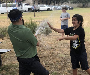 campers playing with water