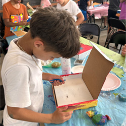 camper making insect box