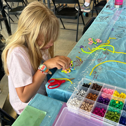 camper making bead key chain