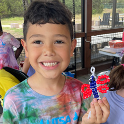 camper holding bead key chain