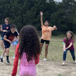 campers playing with water balloons