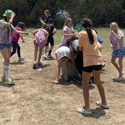 campers playing with water balloons