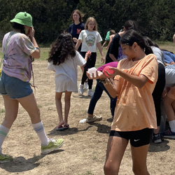 campers playing with water balloons