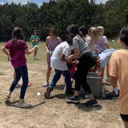 campers playing with water balloons