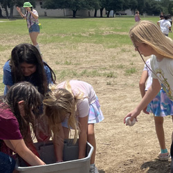 campers playing with water balloons