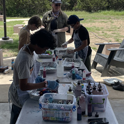 campers making tie-dye shirts