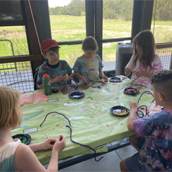 campers making bead animals