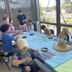 campers making bead animals