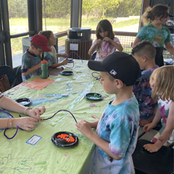 campers making bead animals