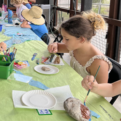 campers painting rocks