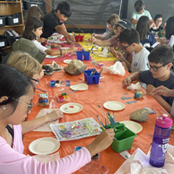 campers painting rocks