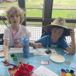 campers painting rocks