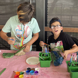 campers painting rocks