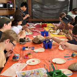 campers painting rocks