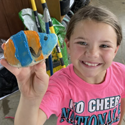 camper displaying painted rock