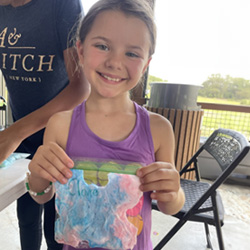 camper holding bag of slime