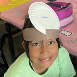 camper with Stream paper plate on head