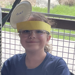 camper with Coast paper plate on head