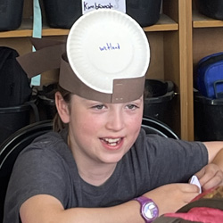 camper with Wetland paper plate on head