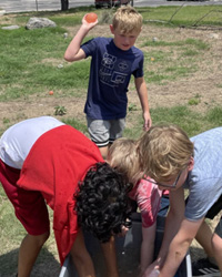 campers playing with water balloons