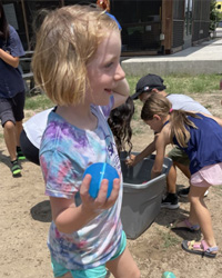 campers playing with water balloons