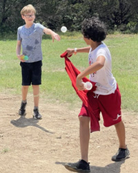 campers playing with water balloons