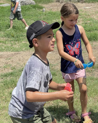 campers playing with water balloons