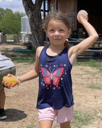 camper throwing water balloon