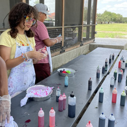 campers making tie-dye shirts