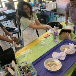 campers making tie-dye shirts