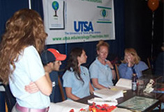 students at event table