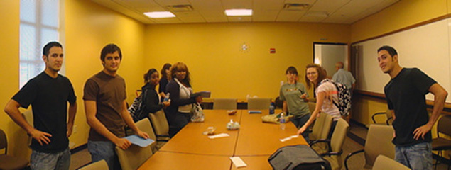 students seated around table