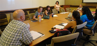 people seated at conference table