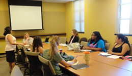 people seated at conference table