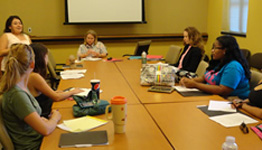 people seated at conference table