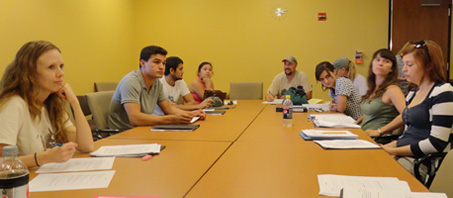 students seated at conference table