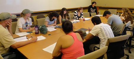 students seated at conference table