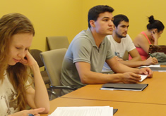 students seated at conference table