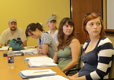 students seated at conference table