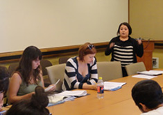 students seated at conference table