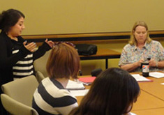 students seated at conference table