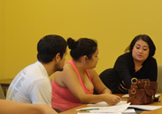 students seated at conference table