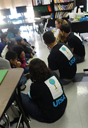 students sitting on classroom floor