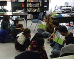 students sitting on classroom floor