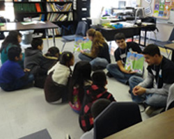 students sitting on classroom floor