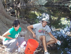 students taking water sample