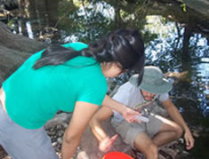 student examining water sample