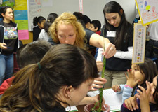 students planting in pots