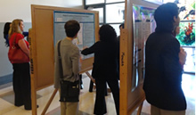 participants looking at posters