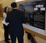 participants looking at posters